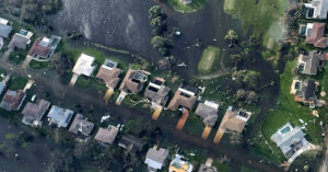 Damage from Hurricane Ian is visible from a U.S. Coast Guard aircraft flying over Fort Myers, Florida on Thursday, September 29, 2022.
