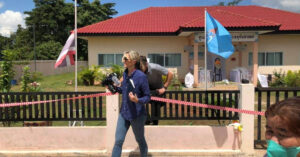 CNN journalists Anna Coren and Daniel Hodge emerge from the scene of a nursery school massacre in Thailand.