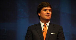 Former Fox News Channel personality Tucker Carlson appears at an event in 2012. (Photo by Gage Skidmore)