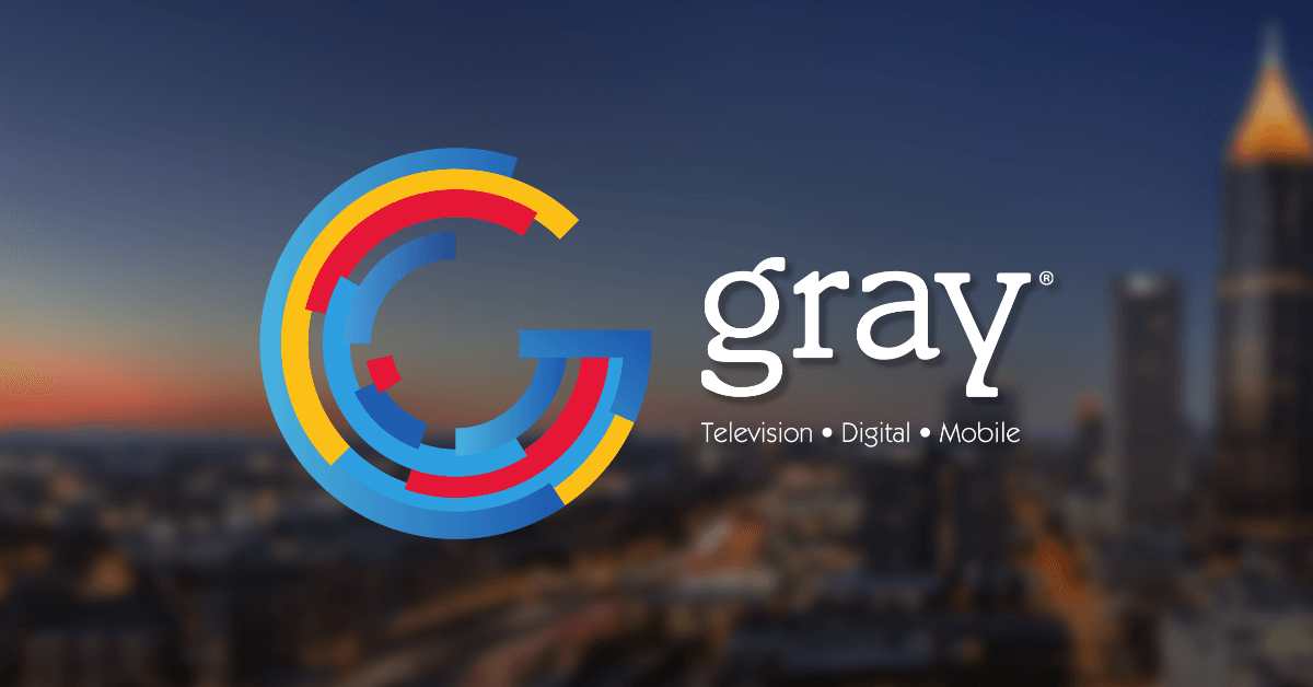 The logo of Gray Television set aside the skyline of Atlanta, where the company is headquartered.