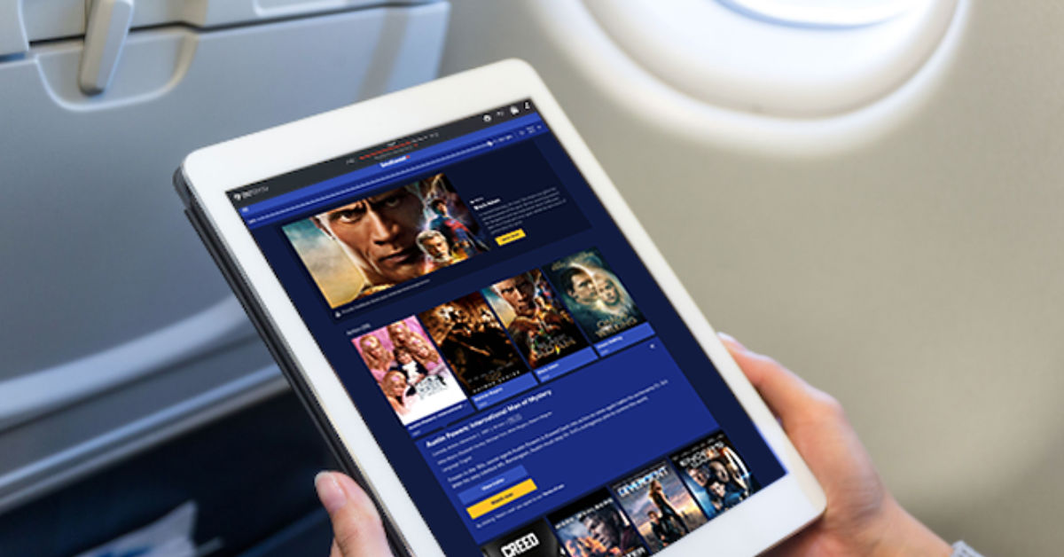 A passenger on a plane streams content from DirecTV. (Courtesy image)