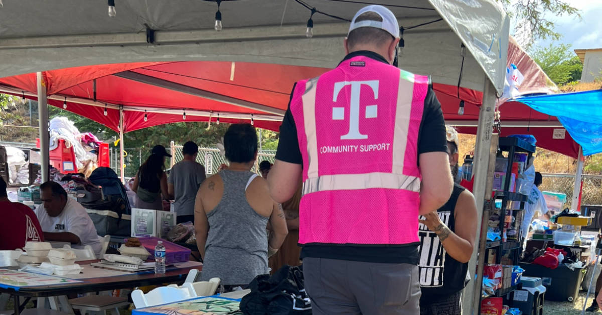 A T-Mobile Community Support team member provides assistance to customers afflicted by wildfires on the Hawaiian island of Maui on August 8, 2023. (Courtesy photo)