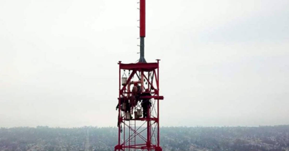 Broadcast engineers and other maintenance workers atop WADL's transmission tower in Detroit. (Courtesy photo)