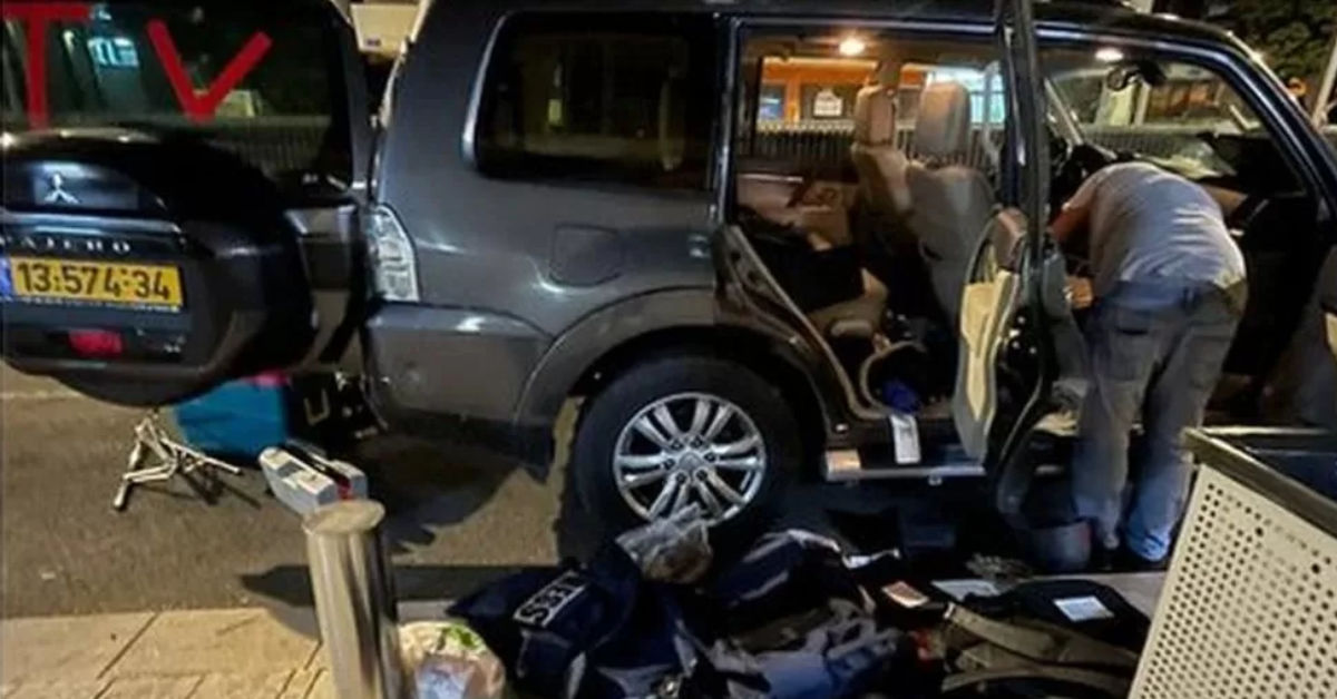Israeli police search a vehicle marked "TV" that was used by a news crew from BBC Arabic. (Photo courtesy BBC News)