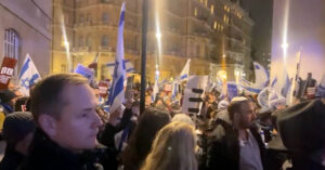 Hundreds of demonstrators assemble outside the London headquarters of the BBC on Monday, October 16, 2023. (Still frame via YouTube broadcast)