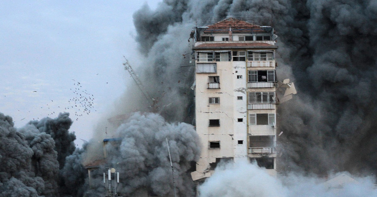 A building in Gaza City suffers damage from an Israeli bombardment campaign in response to a Hamas-led terrorist attack in October 2023. (Photo by Palestinian News & Information Agency via Wikimedia Commons)