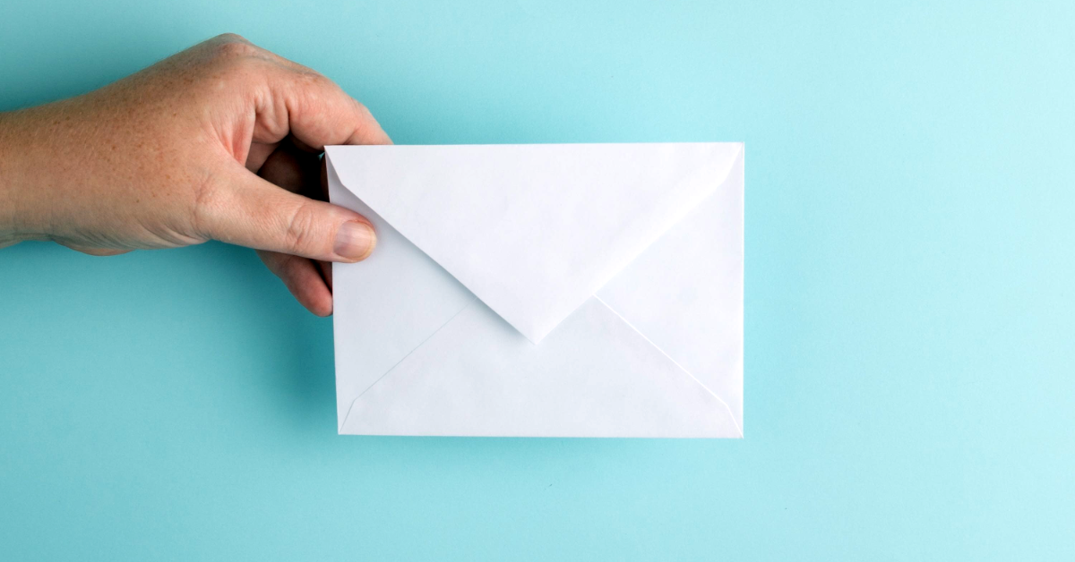 A hand with an envelope.