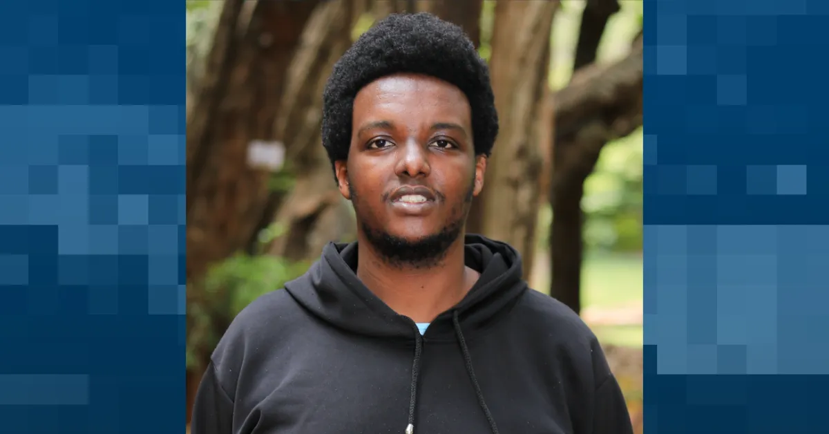 A former Wikipedia employee claims her direct report, Dennis Mbuguru (pictured), harassed her to the point that she was fired. (Photo via Wikimedia Commons, Graphic by The Desk)
