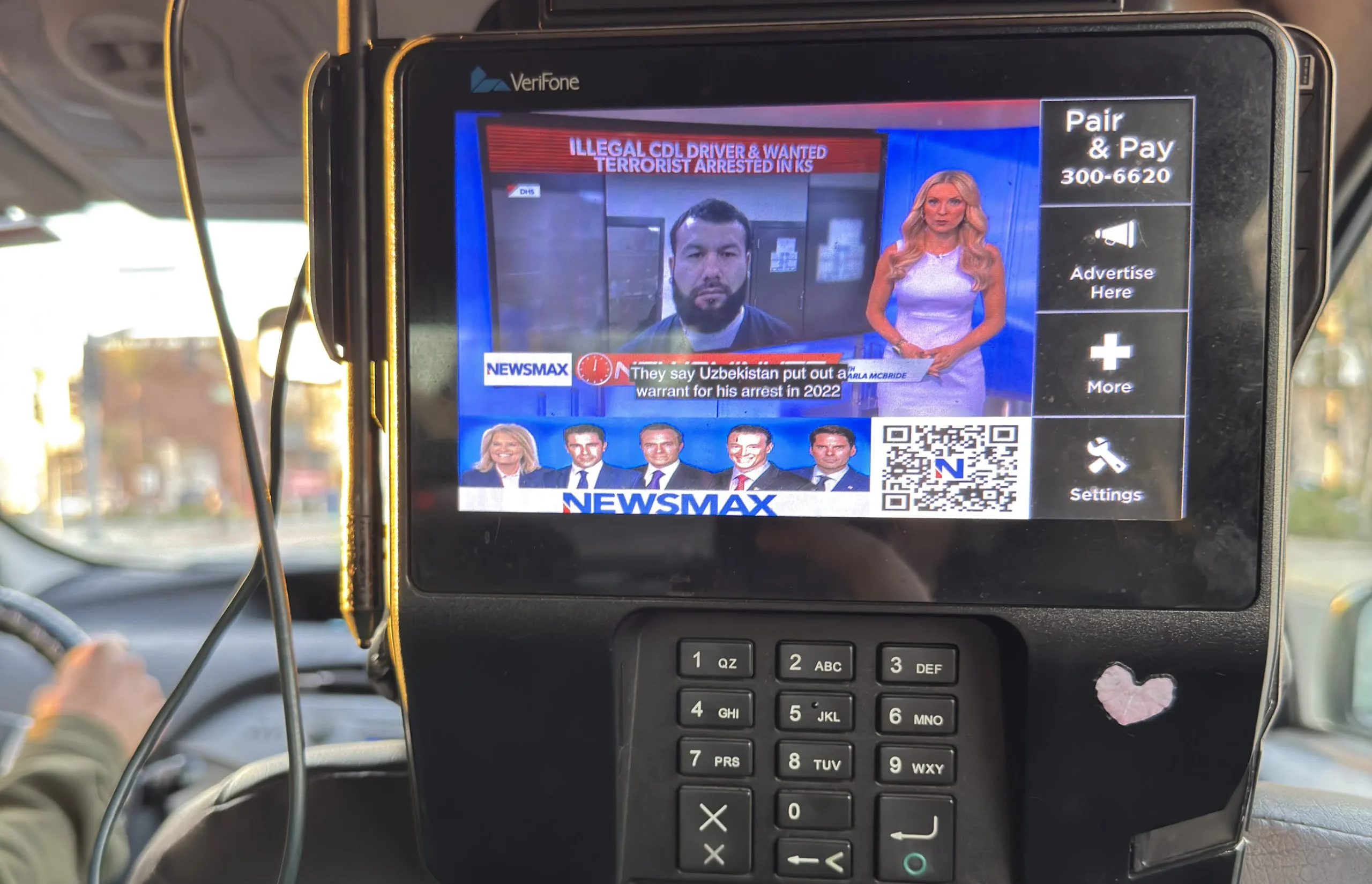 STORY ONLY Newsmax Taxi TV WEBP TD Newsmax on a seat-back television screen in a Los Angeles-area taxi cab. (Photo by Matthew Keys for The Desk)