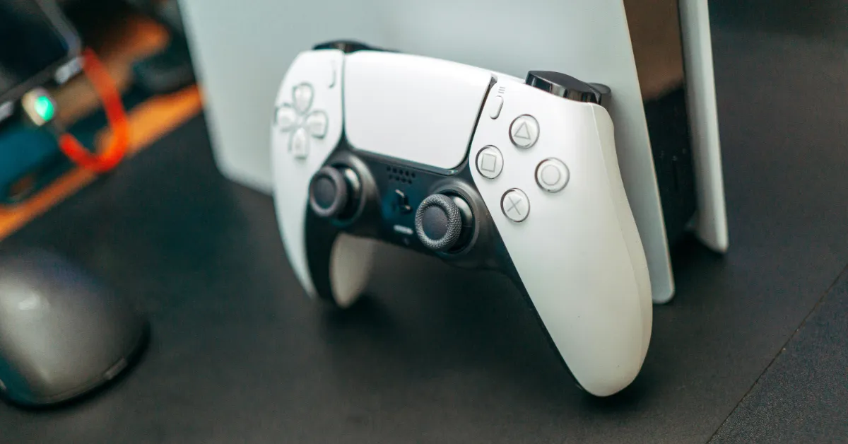 A PlayStation 5 and associated gaming controller. (Stock photo)