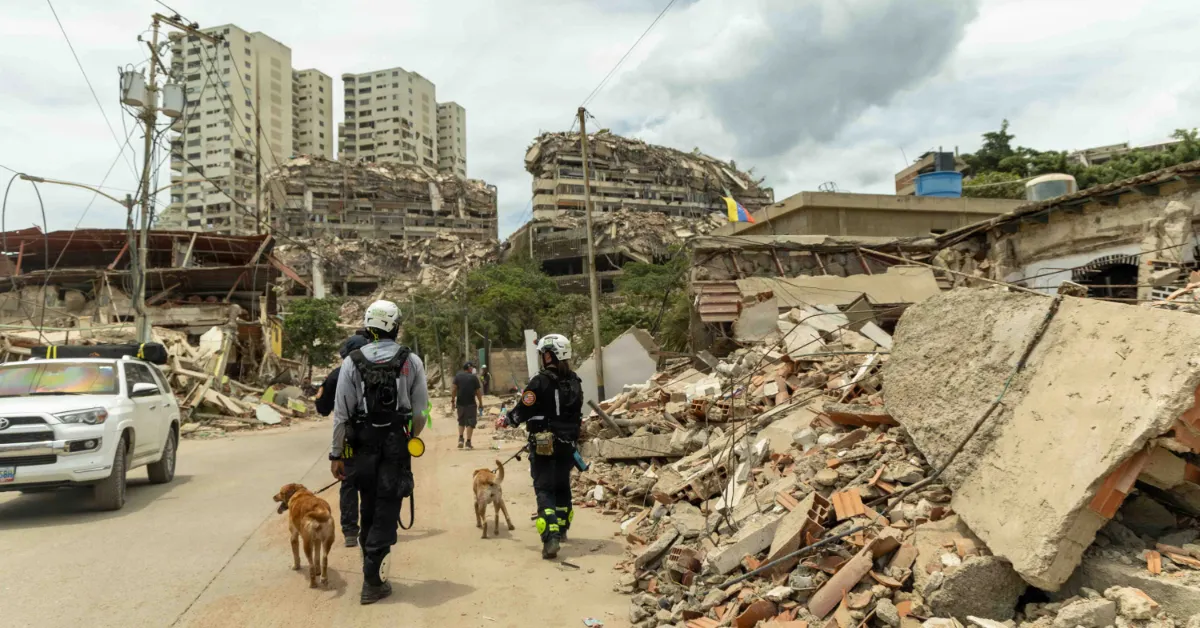 U.S. personal with Miami-Dade Urban Search and Rescue team walk the disaster zone in La Guaira, Venezuela June 28, 2026. At the direction of U.S. Southern Command, assigned to U.S. Military forces are supporting Department of State-led U.S, disaster assistance to the people of Venezuela in the aftermath of June 24, 2026, earthquakes, (Photo courtesy U.S. Marine Corps)