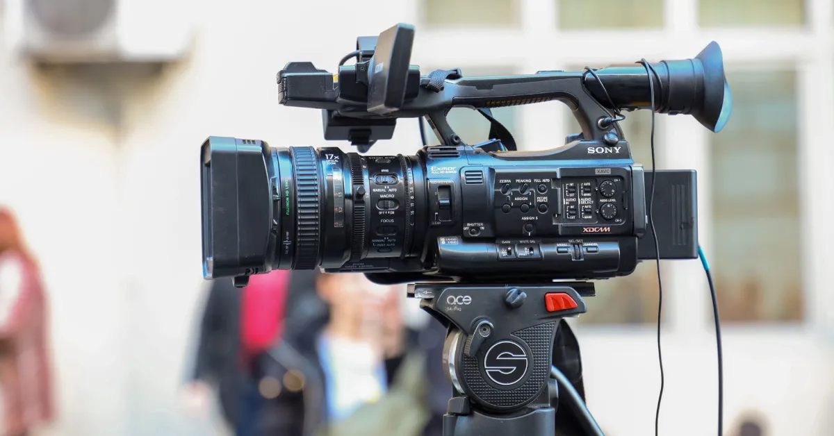 BLANK Media Camera Stock Image 2 WEBP TD Camera on tripod at public event.