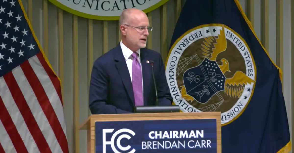 FCC Chairman Brendan Carr speaks during a press conference following the agency’s open meeting in August 2026. (Graphic by The Desk)