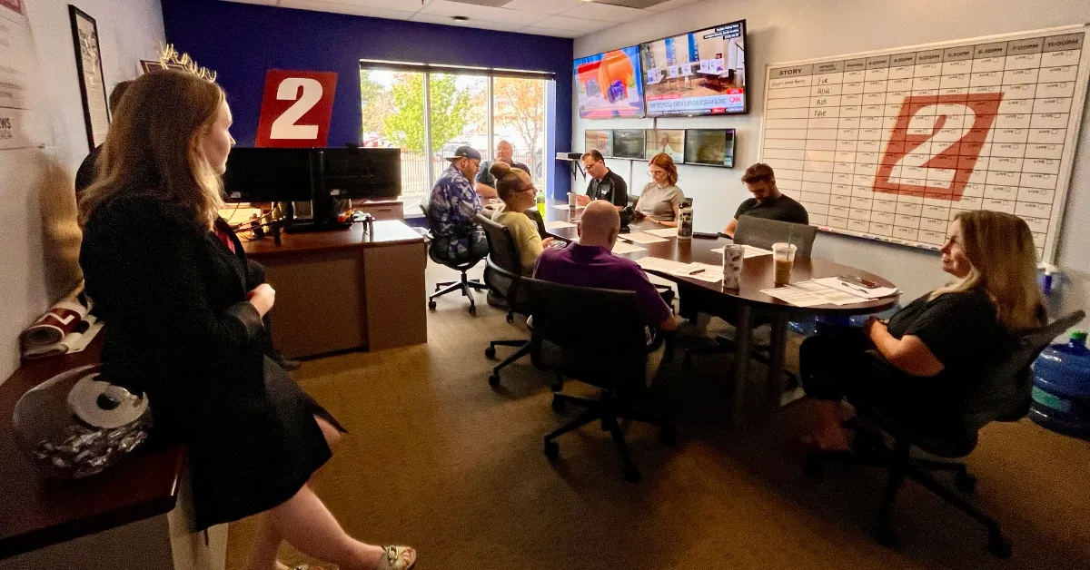Journalists at KTVN listen to a weather briefing from the station's meteorologist during an editorial planning meeting on Hawk Fire coverage. (Photo by Photo by Kellene Stockwell, courtesy Jason Pasco/KTVN)