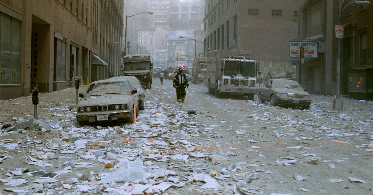 BLANK George Miller September 11 2001 WM WEBP TD A New York City firefighter walks through debris following the collapse of the World Trade Center's two towers on September 11, 2001. (Phot by George Miller, New York City Transit Authority/public domain)
